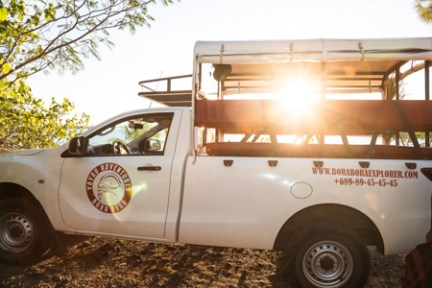 a truck is parked in front of a car