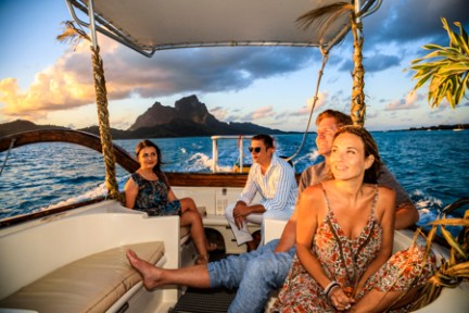 a group of people standing in front of a body of water