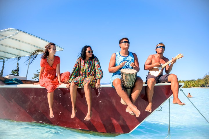 a group of people on a boat in the water