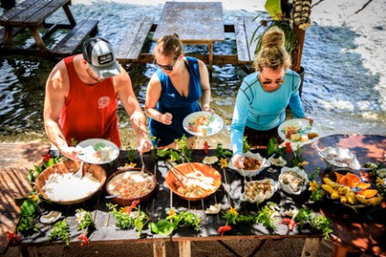 a group of people sitting at a picnic table